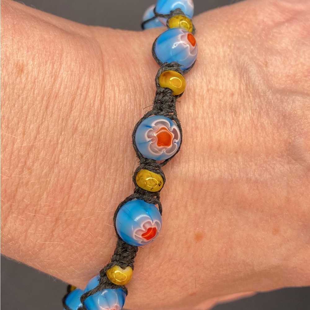 HANDCRAFTED/HANDMADE Red, White, and Blue Glass Flower Beads with Black Hemp